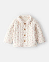 Ivory padded jacket with a floral print