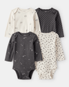 4-pack of long-sleeve bodysuits in black and white with bows