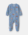 Pijama de terciopelo con pie, dinosaurios en azul