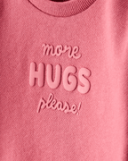 Sudadera rosa con mensaje “More Hugs Please” - Carter's